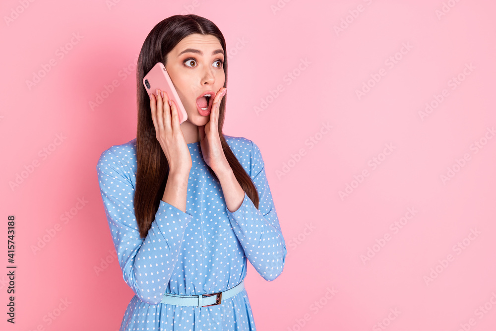 Photo of young beautiful shocked amazed surprised girl hold hand cheek talk phone hear bad news isolated on pink color background Photo of young beautiful shocked amazed surprised girl hold hand cheek talk phone hear bad news isolated on pink color background