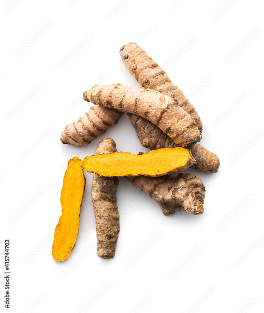 Indian turmeric root. Turmeric spice. Yellow turmeric on white background. Indian turmeric root. Turmeric spice. Yellow turmeric on white background.