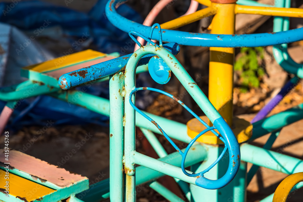 Children carousel on playground in park