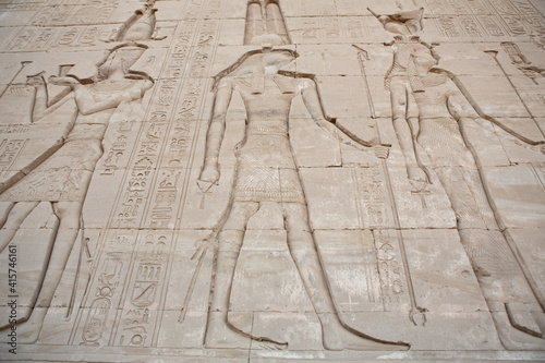 Dendera Temple complex in Egypt. Hieroglypic carvings on wall at the ancient egyptian temple.