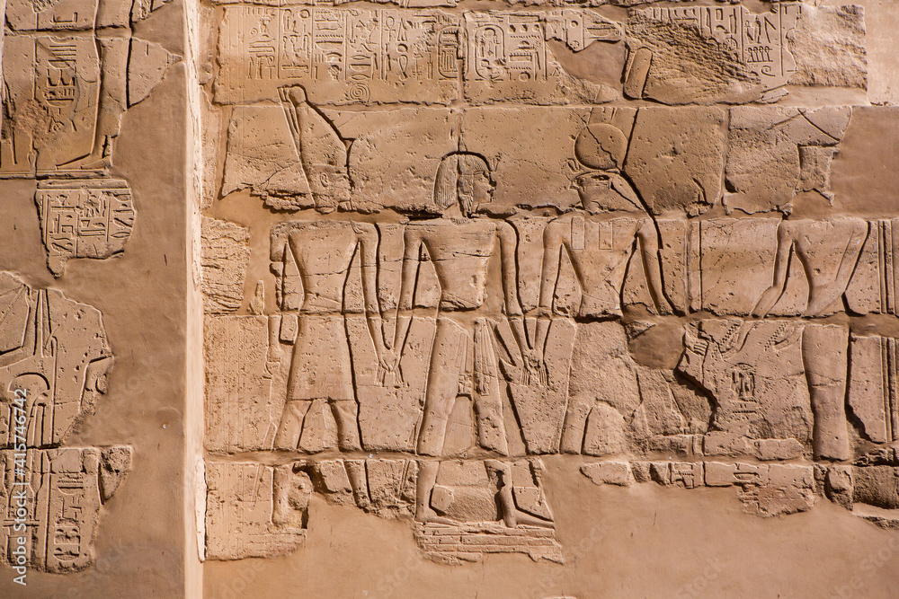 Dendera Temple complex in Egypt. Hieroglypic carvings on wall at the ancient egyptian temple. Dendera Temple complex in Egypt. Hieroglypic carvings on wall at the ancient egyptian temple.