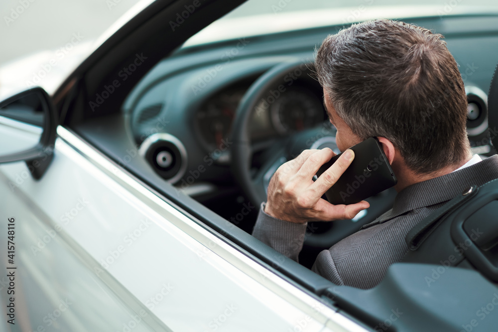 Businessman driving and phone calling