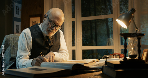 Academic professor working in his office photo