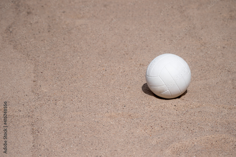 White beach volleyball in the sand. Team sport concept