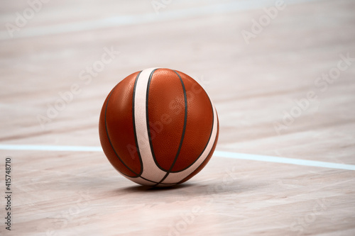 Basketball on basketball parquet floor. Basketball Sports Background