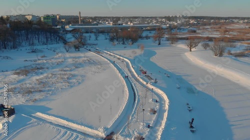 Winter park near the city aerial drone view push in forward camera movement Irpin Ukraine photo