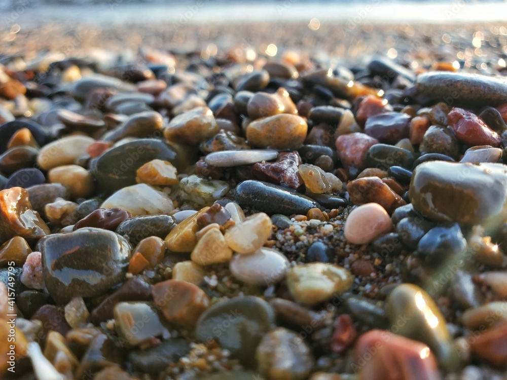 Wet sea pebbles. Wet sea pebbles.