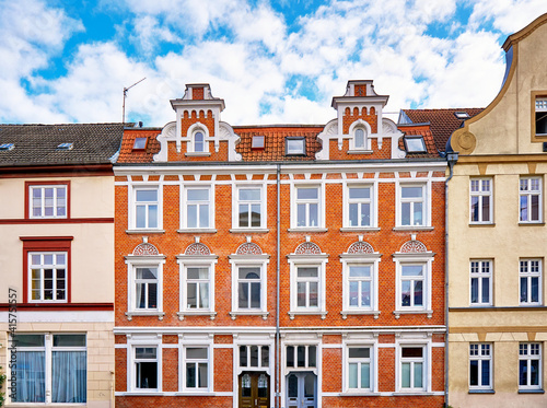Renovated old house with ornate dormer windows and a beautiful facade in the old town of Wismar. Germany