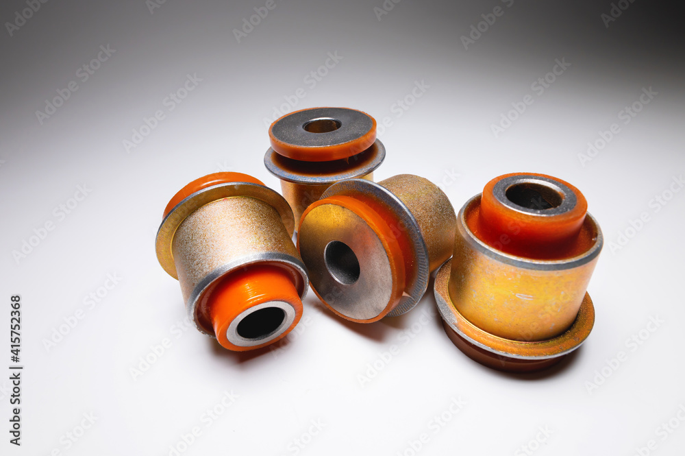 A set of polyurethane silent blocks bushing for the front axle of an off-road car. New polyurethane parts A set of polyurethane silent blocks bushing for the front axle of an off-road car. New polyurethane parts