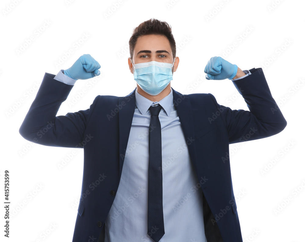 Businessman with protective mask and gloves showing muscles on white background. Strong immunity concept Businessman with protective mask and gloves showing muscles on white background. Strong immunity concept