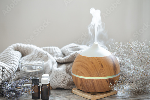 Composition with an air humidifier and a set of aromatic oils. photo