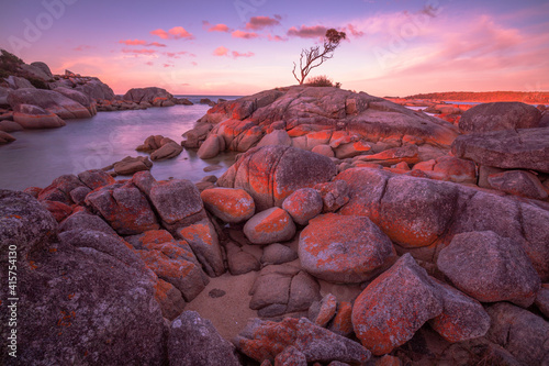 Beautiful ,sunset, at  Binalong Bay. Colourful  coloured rocks and boulders. Bay of Fires Conservation Area. North Eastern Tasmania, Australia