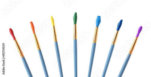 Collage of brushes with different bright paints on white background, banner design