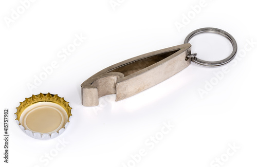 Bottle opener in form of keychain and used bottle cap
