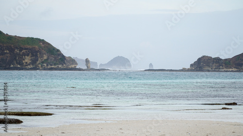 Kuta Beach on an overcast day with grey sky on Lombok island in Indonesia.