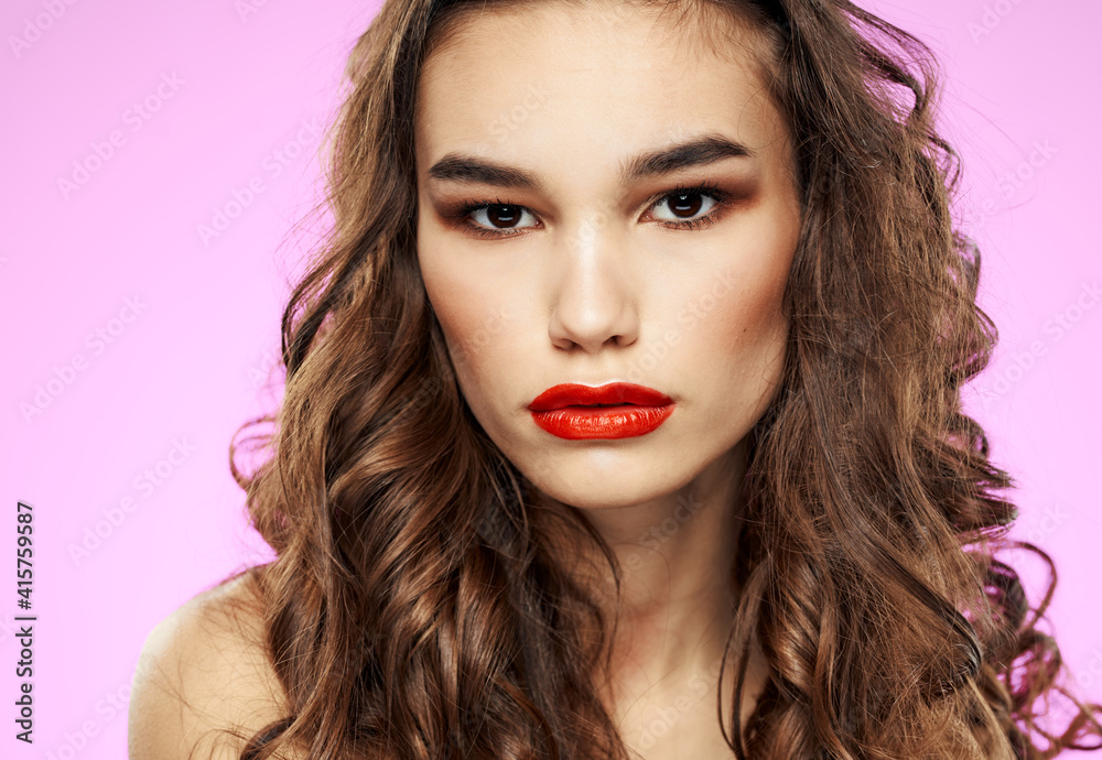 Romantic woman with red lips eye shadow and pink background Romantic woman with red lips eye shadow and pink background