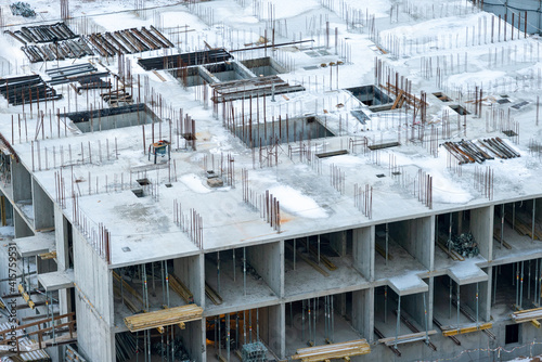 Top view of the construction of a multi-storey building in winter © andrei310