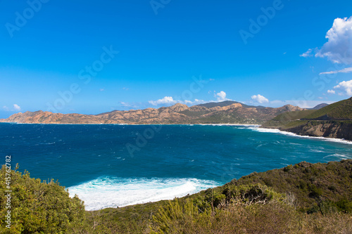 Panoramic view of the mediterranean sea and the mountain range in the background. Cap Corse, Corsica, France. Tourism and vacations concept.