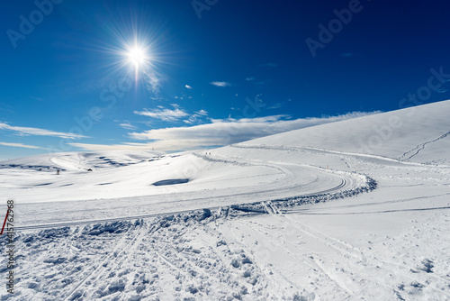 Cross-Country Skiing Tracks and footpath with snow in winter. Altopiano della Lessinia (Lessinia Plateau), Regional Natural Park, near Malga San Giorgio, ski resort in Verona province, Veneto, Italy, 