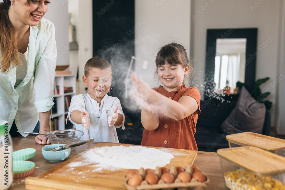 mother baking with their children at home mother baking with their children at home