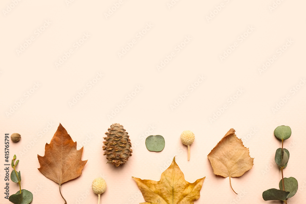 Flat lay composition with autumn leaves on light background, space for text