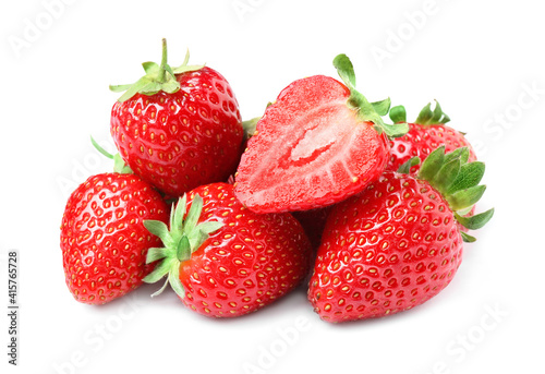 Pile of delicious cut and whole strawberries on white background
