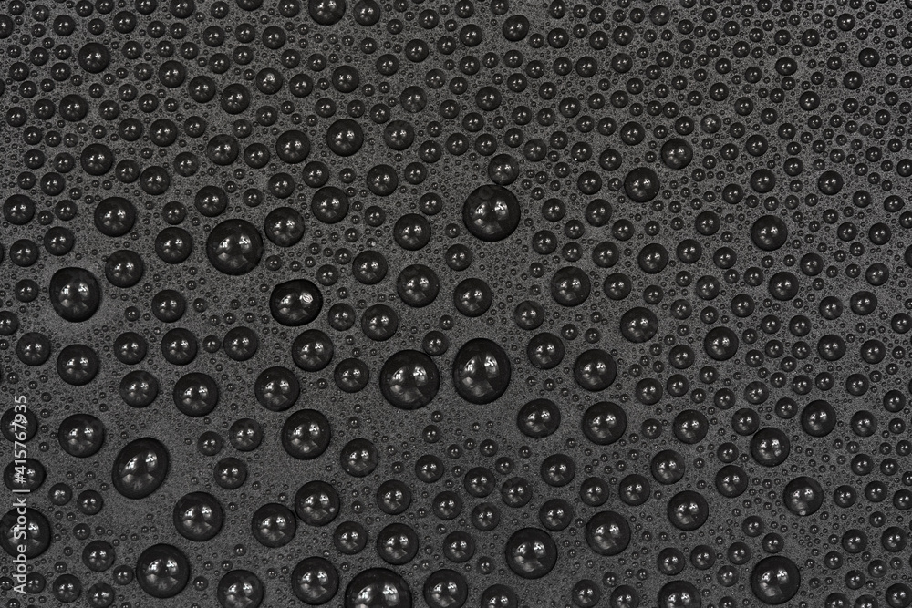 Water drops on black background texture. Dark backdrop glass covered with drops of water. gray bubbles in water Water drops on black background texture. Dark backdrop glass covered with drops of water. gray bubbles in water