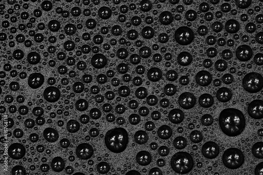 Water drops on black background texture. Dark backdrop glass covered with drops of water. gray bubbles in water Water drops on black background texture. Dark backdrop glass covered with drops of water. gray bubbles in water