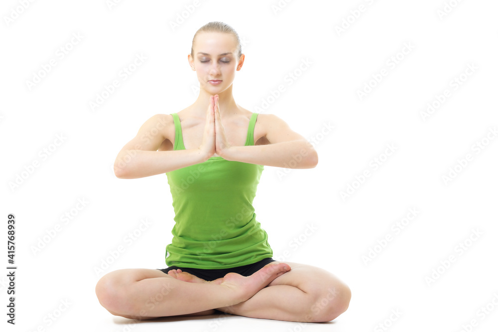 young blond hair woman in yoga pose siddhasana