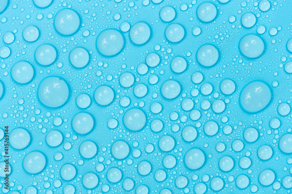 Water drops on blue background texture. Backdrop glass covered with drops of water. bubbles in water