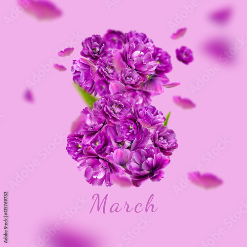 Concept of 8 March holiday. Numeral 8 from lilac purple tulips on purple background. International Women s Day. Flower Greeting card for women  floral composition. Spring  holiday  layout  art