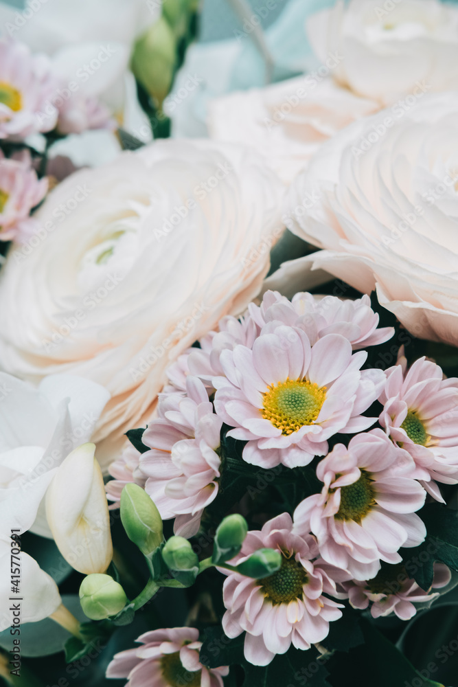 Beautiful flowers in wrapping: white big roses and wildflowers. Spring background. Beautiful flowers in wrapping: white big roses and wildflowers. Spring background.