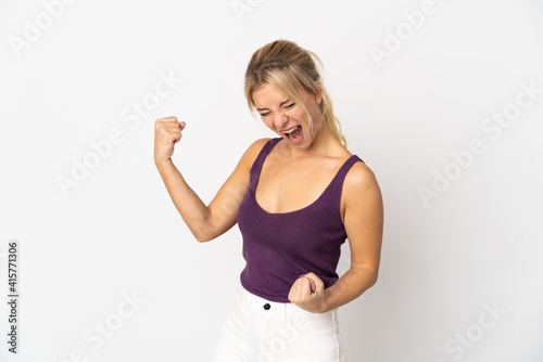 Young Russian woman isolated on white background celebrating a victory