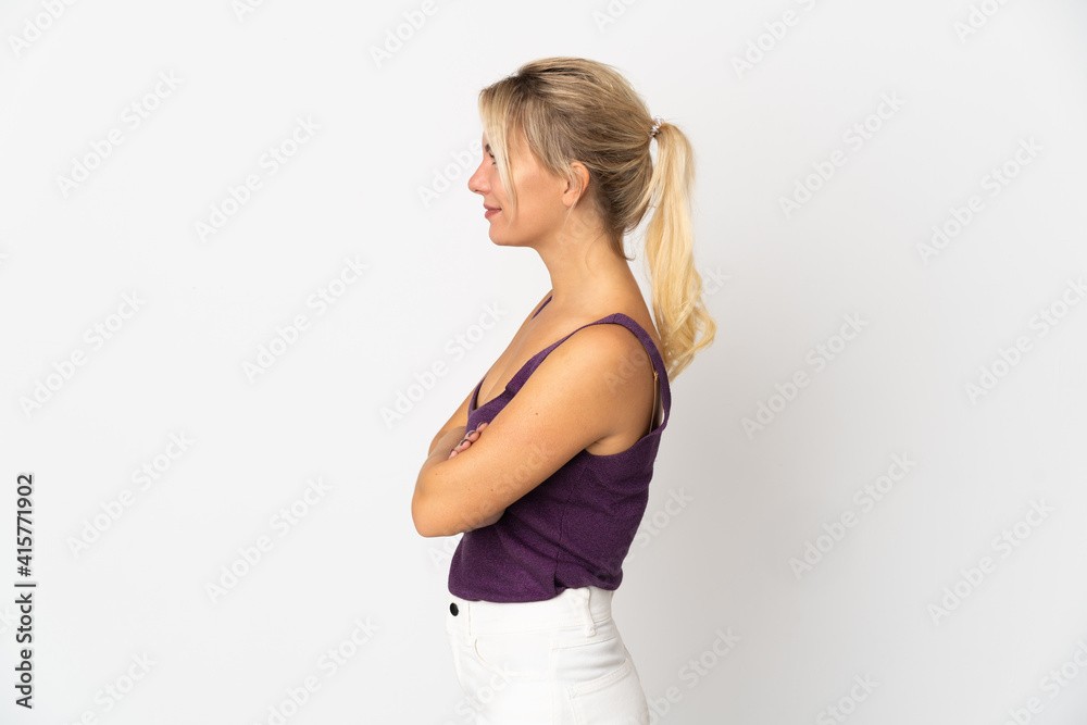 Young Russian woman isolated on white background in lateral position Young Russian woman isolated on white background in lateral position