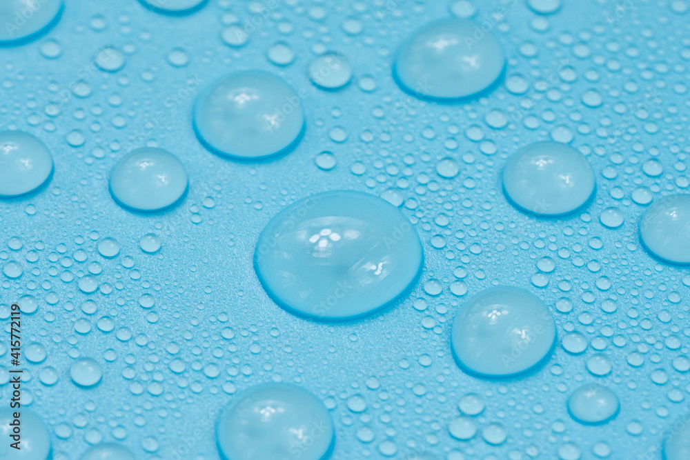 Water drops on blue background texture. Backdrop glass covered with drops of water. bubbles in water Water drops on blue background texture. Backdrop glass covered with drops of water. bubbles in water