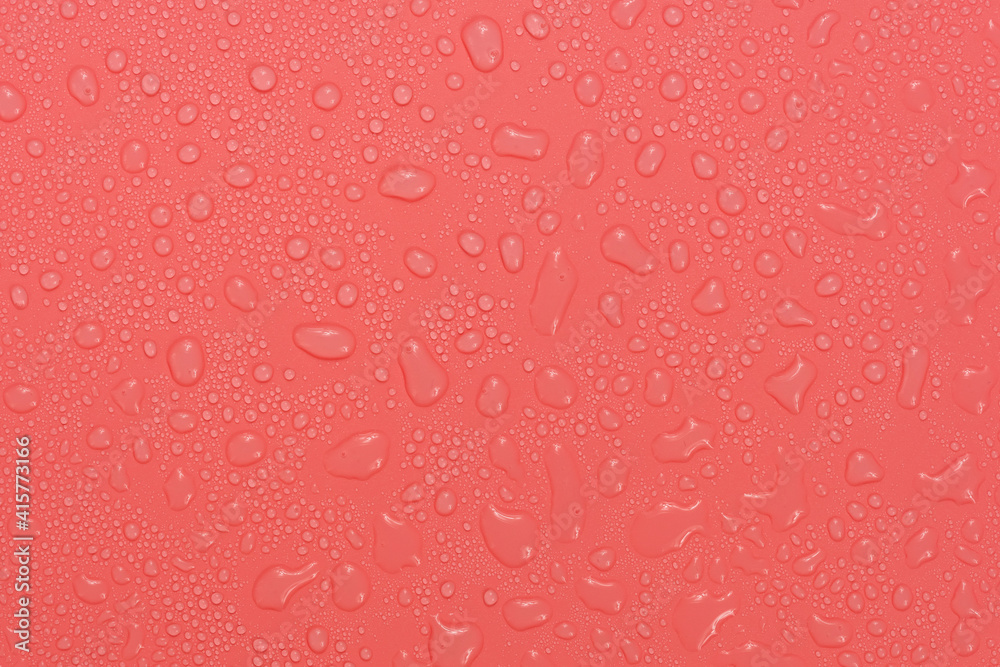 Water drops on red background texture. backdrop glass covered with drops of water. bubbles in water Water drops on red background texture. backdrop glass covered with drops of water. bubbles in water