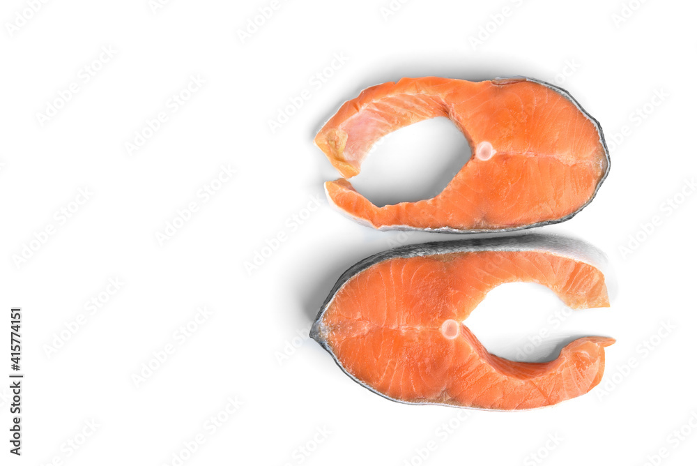 Red fish steak (salmon or trout) isolated on white background. Top view. Red fish steak (salmon or trout) isolated on white background. Top view.