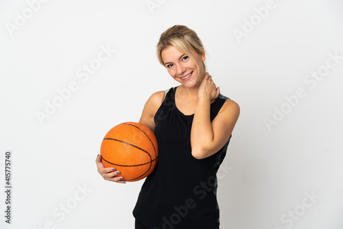 Young Russian woman playing basketball isolated on white background laughing © luismolinero