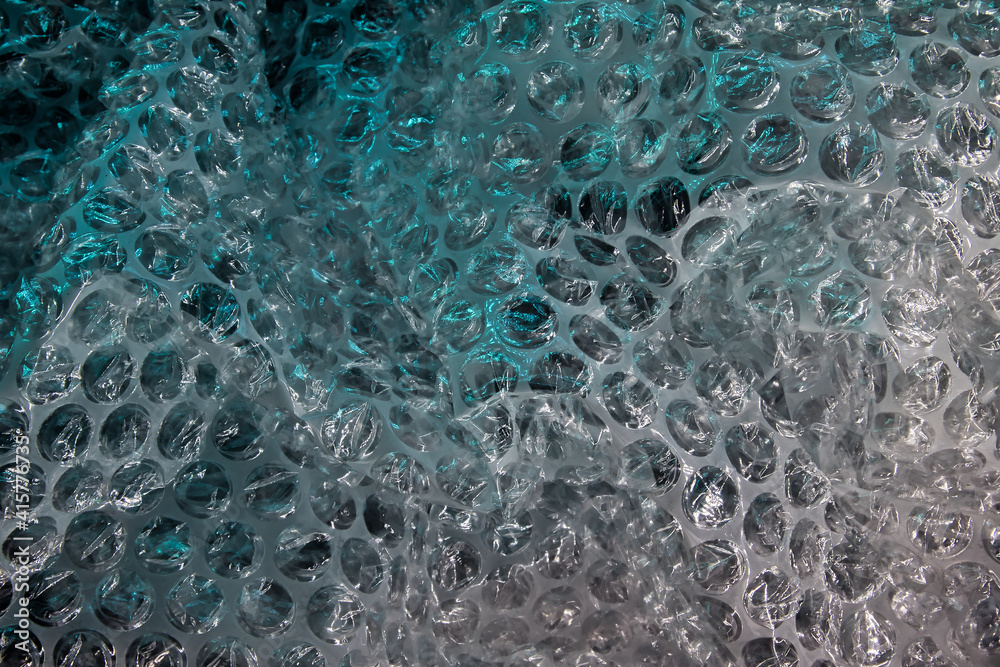 Blue bubble wrap texture. Abstract light blue neon background. Flat lay