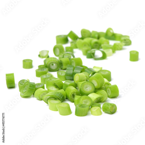 chopped green onions on white background