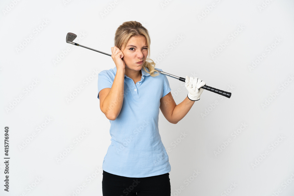 Young Russian golfer woman isolated on white background frustrated and covering ears Young Russian golfer woman isolated on white background frustrated and covering ears