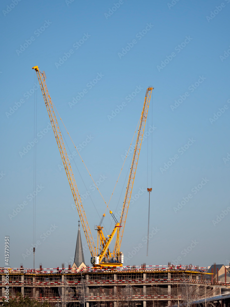 Building Under Construction, Crane and beautiful clouds no birds Building Under Construction, Crane and beautiful clouds no birds