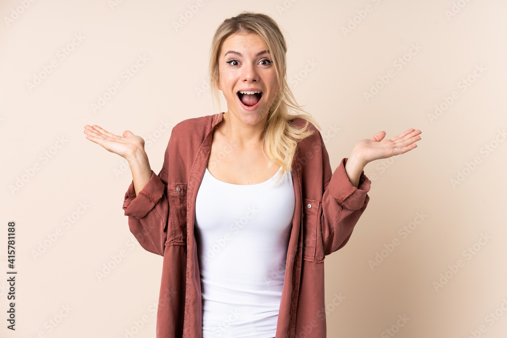 Blonde woman over isolated background with shocked facial expression Blonde woman over isolated background with shocked facial expression