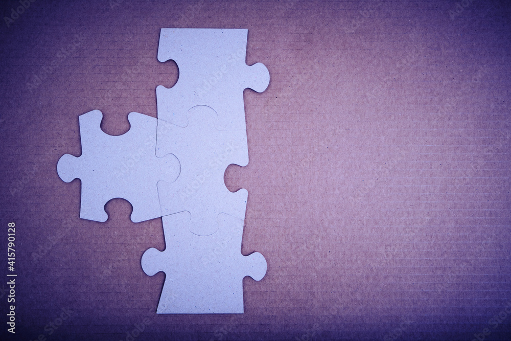 Obraz premium Assembled puzzle pieces with an empty space for inscription.