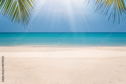 Fototapeta Naklejka Na Ścianę i Meble -  Tropical nature clean beach and white sand in summer with sun light blue sky background.