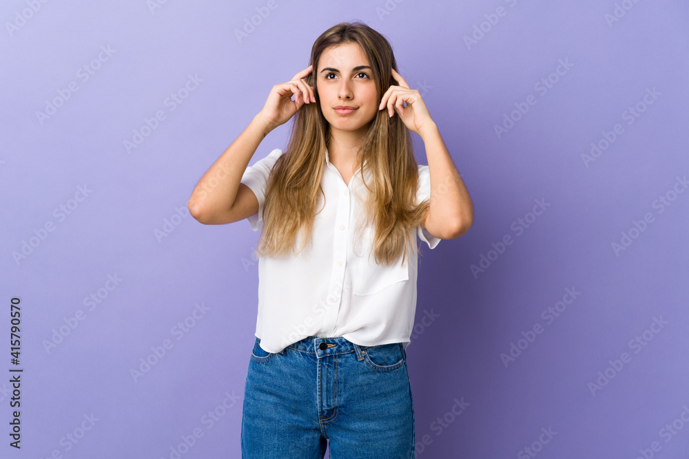 Young woman over isolated purple background having doubts and thinking Young woman over isolated purple background having doubts and thinking