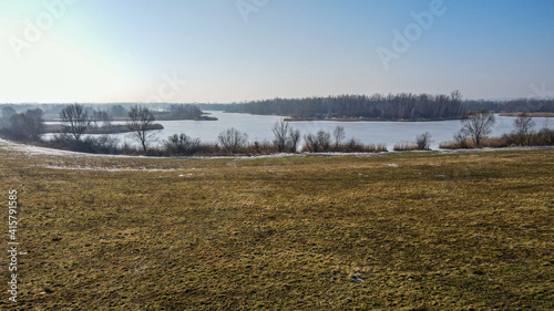 stawy i jeziora w polderze Buków, suchy zbiornik przeciwpowodziowy zimą na Śląsku w Polsce z lotu ptaka 