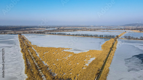 stawy rybne hodowlane w zimie z lotu ptaka na Śląsku w Polsce