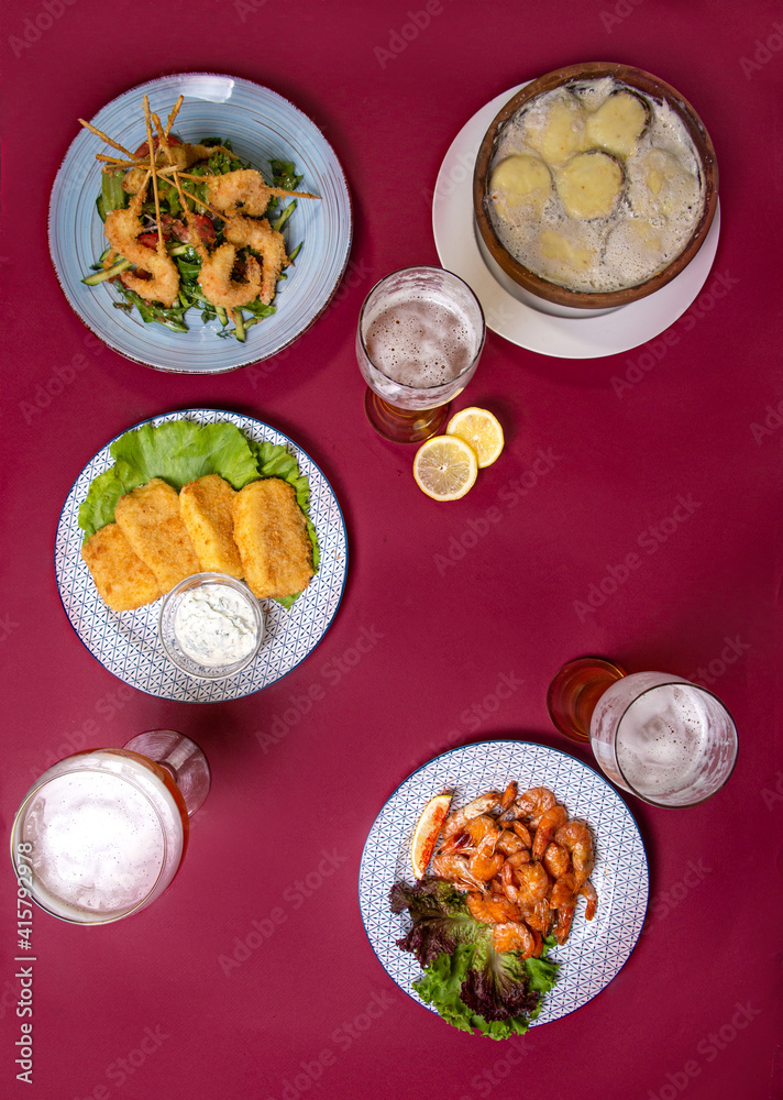 snacks and beer top view. photography of food on a burgundy background snacks and beer top view. photography of food on a burgundy background