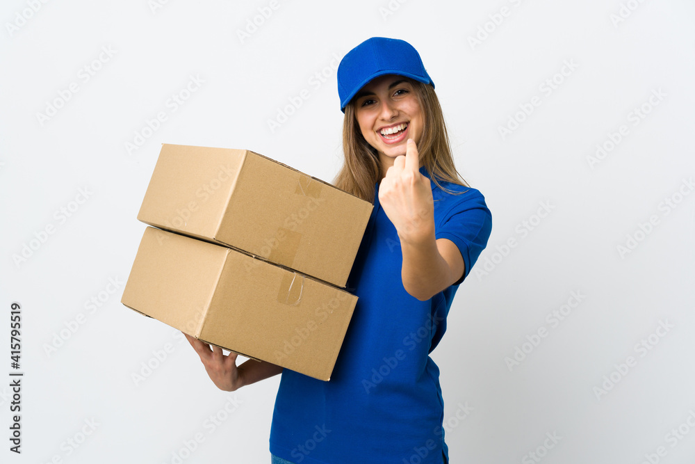 Young delivery woman over isolated white background doing coming gesture Young delivery woman over isolated white background doing coming gesture